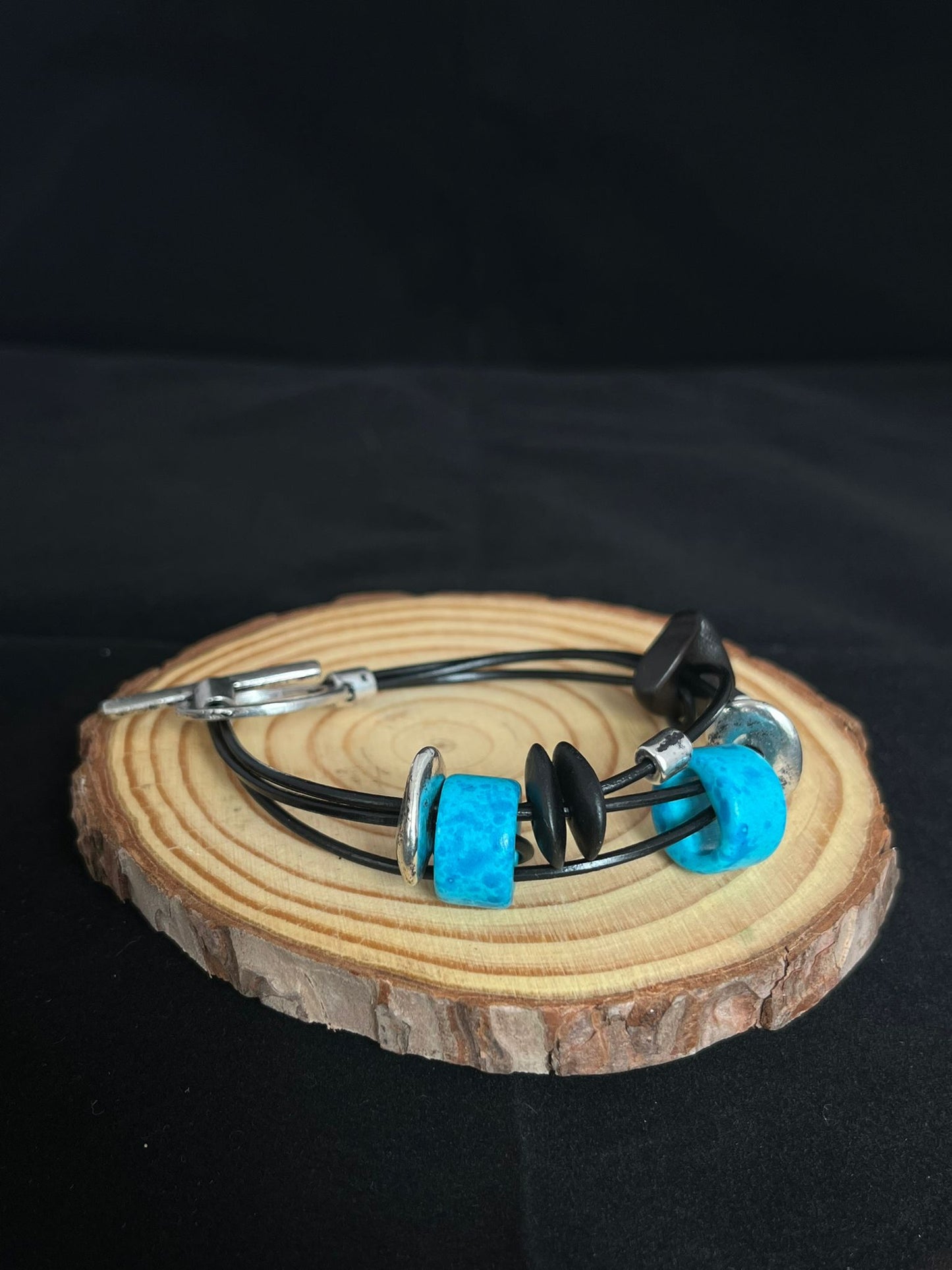 Handmade ceramic bead bracelet in blue, black & silver