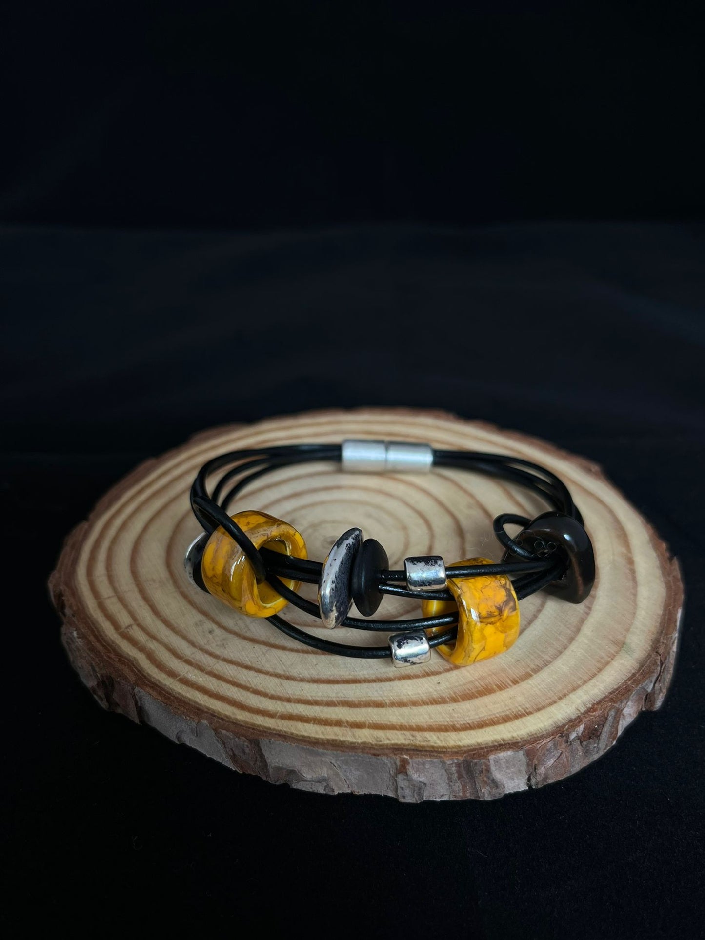 Ceramic bead bracelet in mustard, black, silver