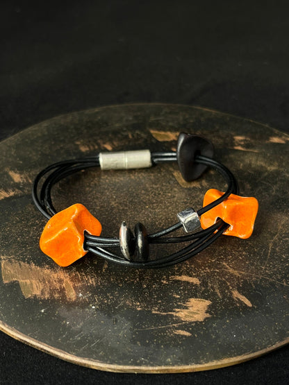 Ceramic Bead Bracelet in Orange, Black and Silver.